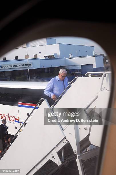 Los Angeles Lakers head coach Phil Jackson boards the team plane en route to Los Angeles following Game Four of the Western Conference Semifinals in...