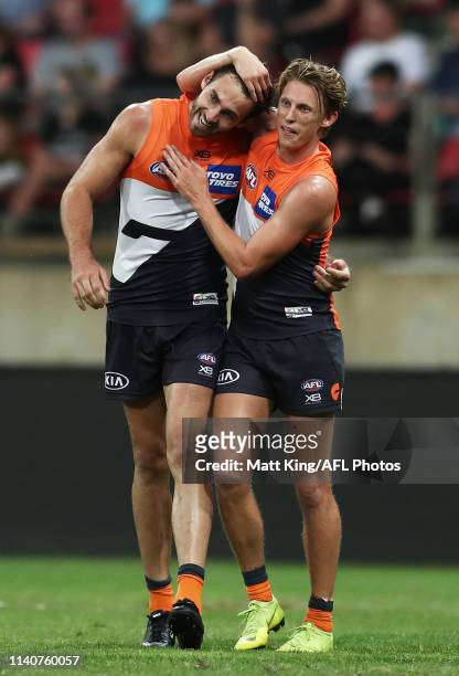 Jeremy Finlayson of the Giants celebrates with Lachie Whitfield after kicking a goal during the round three AFL match between the Greater Western...