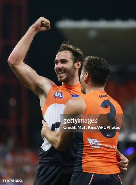 Jeremy Finlayson of the Giants celebrates with Stephen Coniglio after kicking a goal during the round three AFL match between the Greater Western...