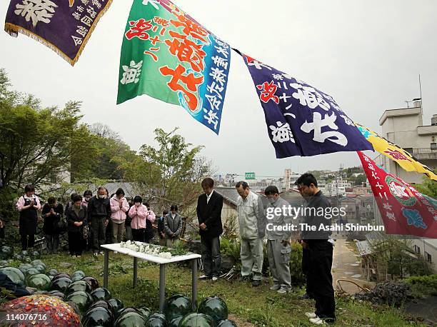 People pray for the earthquake and tsunami victims on May 11, 2011 in Kesennuma, Miyagi, Japan. Japan commemorate the two months anniversary of the...