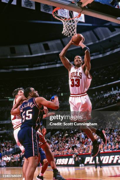 Scottie Pippen of the Chicago Bulls dunks the ball against the New Jersey Nets during Game Two of Round One of the 1998 NBA Playoffs on April 26,...