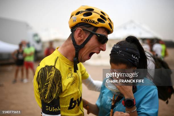 Sapin's Alex Roca Campillo celebrates with girlfriend at the end of Stage 5 of the 14th edition of Titan Desert 2019 mountain biking race between...