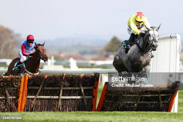 Jockey Harry Skelton ridding Aux Ptits Soins clears the last hurdle in the Gaskells Handicap Hurdle race during the Randox Health Grand National...