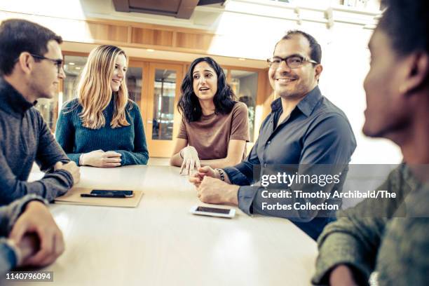 Neo founder, Ali Partovi, partner Nadia Singer are photographed with Neo scholars Joshua Meier and Christina Wadsworth for Forbes Magazine on October...