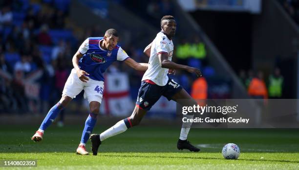 Sammy Ameobi of Bolton gets past Collin Quaner of Ipswich Town during the Sky Bet Championship match between Bolton Wanderers and Ipswich Town at...