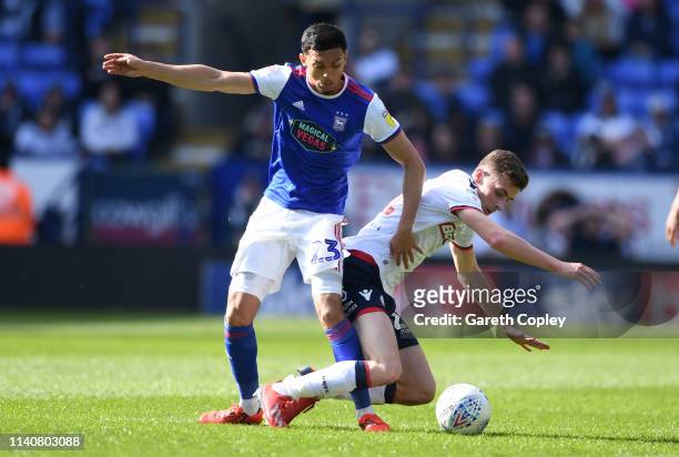 Andre Dozzell of Ipswich is tackled by Joe Williams of Bolton during the Sky Bet Championship match between Bolton Wanderers and Ipswich Town at...
