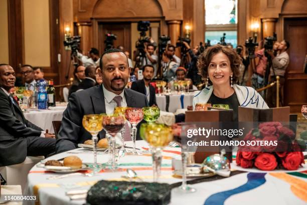 Abiy Ahmed, Prime Minister of Ethiopia and Audrey Azoulay, UNESCO's Director-General, sit at a table during the Guillermo Cano World Press Freedom...
