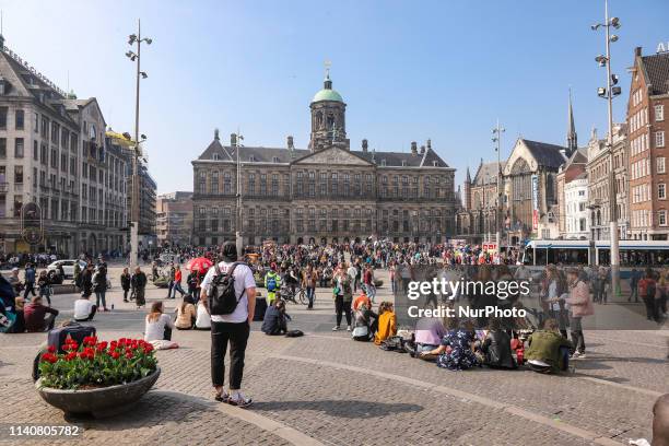 Dam Square in Amsterdam, a town square in the Dutch capital. Dam Square is a popular historic market square in the center of the city for locals and...