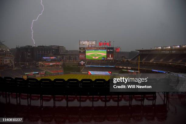 Lightning strikes during a rain delay prior to the start of the game between the Washington Nationals and the St. Louis Cardinals at Nationals Park...