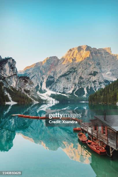 sunrise on the braies lake / prague wild lake, italy - pragser wildsee stock pictures, royalty-free photos & images