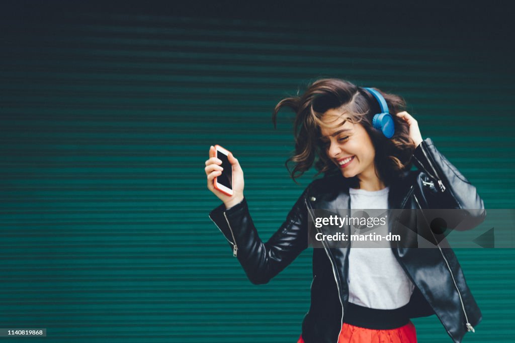 Young girl dancing to the music