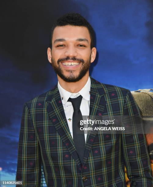 Actor Justice Smith attends the premiere of "Pokemon Detective Pikachu" at Military Island - Times Square on May 2, 2019 in New York City.