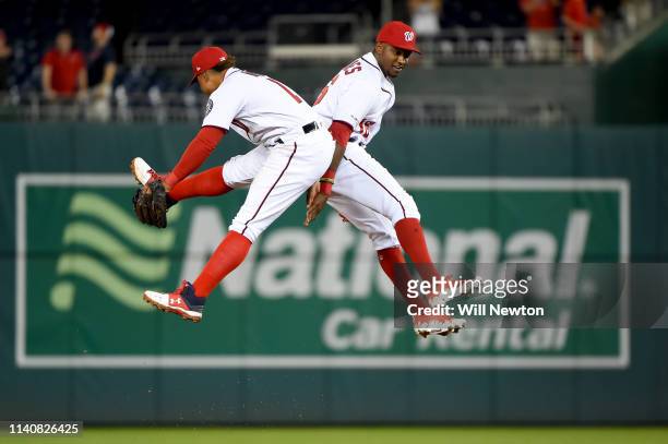 Victor Robles and Wilmer Difo of the Washington Nationals celebrate after defeating the St. Louis Cardinals at Nationals Park on May 2, 2019 in...