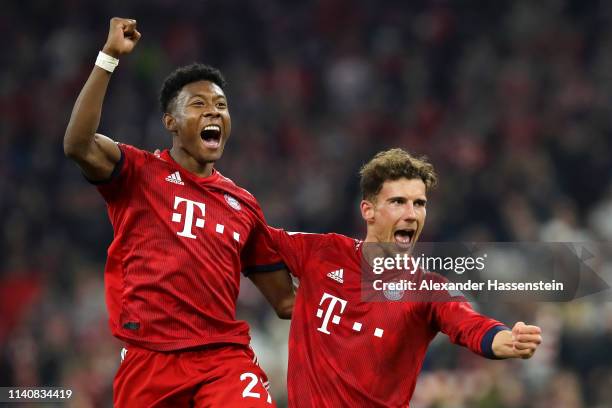 David Alaba of Bayern Munich celebrates victory with Leon Goretzka of Bayern Munich after the Bundesliga match between FC Bayern Muenchen and...