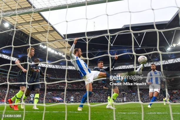 Aymeric Laporte of Manchester City saves a certain goal as he beats Glenn Murray of Brighton & Hove Albion to the ball during the FA Cup Semi Final...