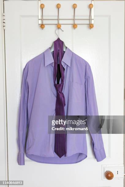 formal shirt hanging on door - formal shirt stock pictures, royalty-free photos & images