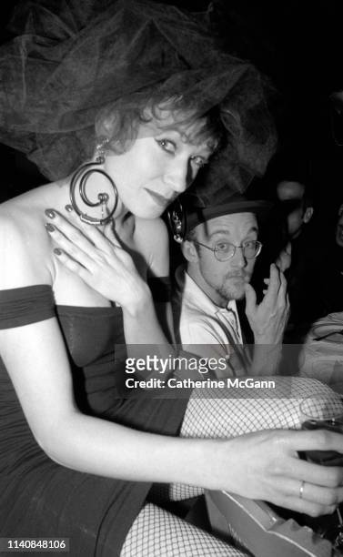 Ann Magnuson and Keith Haring at a party at Guignol's restaurant in April 1987 in New York City, New York.