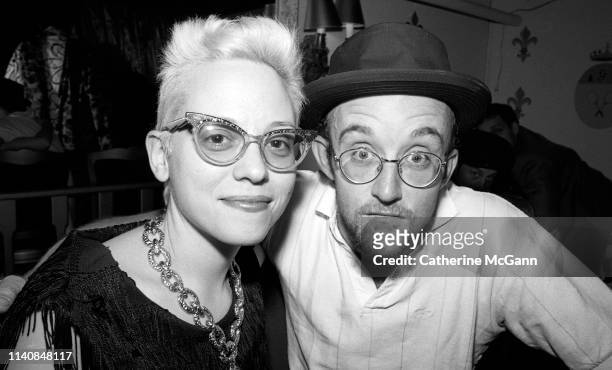 Dany Johnson and Keith Haring at a party at Guignol's restaurant in April 1987 in New York City, New York.