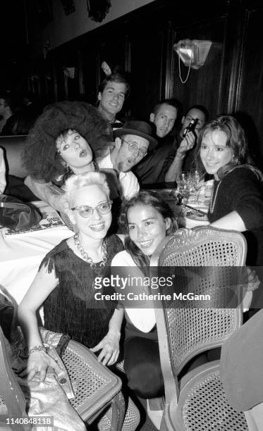 Clockwise from lower left: Dany Johnson, Ann Magnuson, Stefan Haves, Keith Haring , Kenny Scharf , unidentified, Hope Haves, and Tereza Scharf at a...