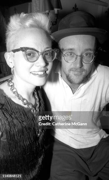 Dany Johnson and Keith Haring at a party at Guignol's restaurant in April 1987 in New York City, New York.