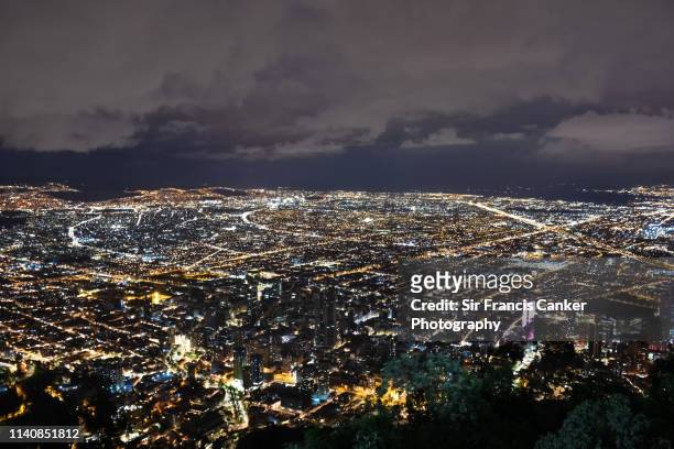 aerial view of bogotá skyline illuminated at night in cundinamarca, colombia - colombia pattern stock pictures, royalty-free photos & images