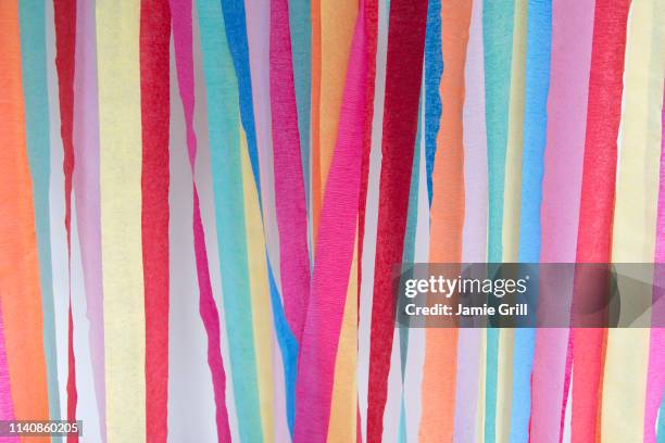 colorful paper streamers - luftschlange stock-fotos und bilder