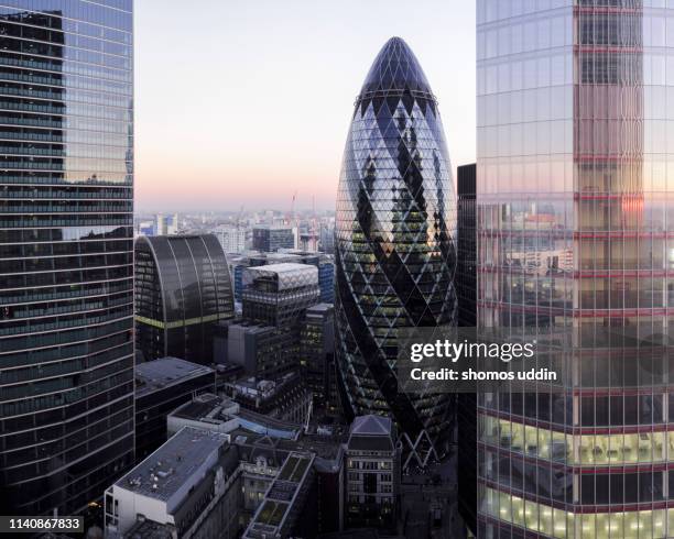 elevated view of london financial district at dusk - swiss re tower stock pictures, royalty-free photos & images