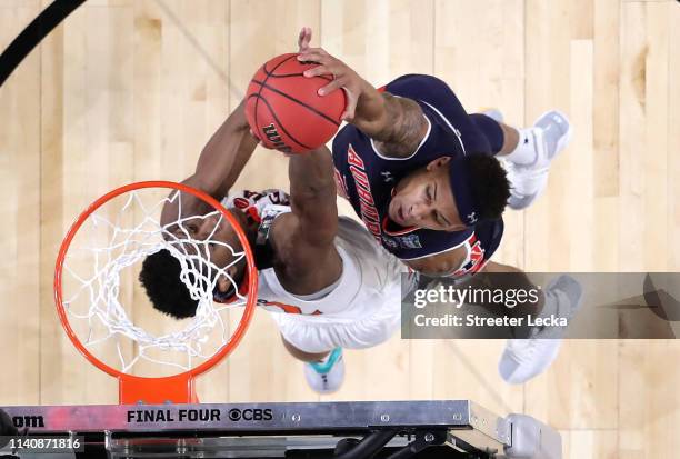 De'Andre Hunter of the Virginia Cavaliers blocks a dunk by Bryce Brown of the Auburn Tigers in the second half during the 2019 NCAA Final Four...