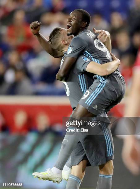 Abu Danladi of Minnesota United celebrates his goal with teammate Osvaldo Alonso in the first half against the New York Red Bulls at Red Bull Arena...