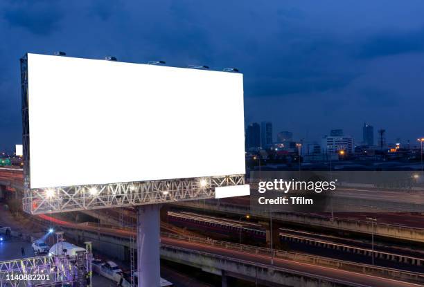 billboard street on light trails for outdoor advertising poster or blank billboard at night time for advertisement. street light. - billboard night stock pictures, royalty-free photos & images