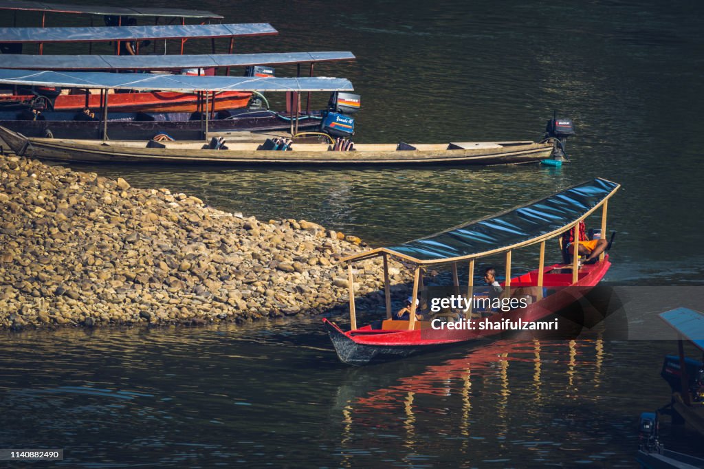 Boat is a main transportation in tropical rain forest landscape at Taman Negara, Pahang, Malaysia.