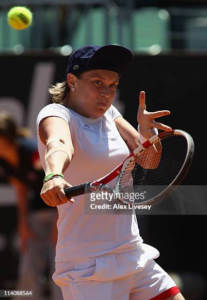 Romina Oprandi of Italy plays a backhand return during her second round match against Daniela Hantuchova of Slovakia during day four of the...