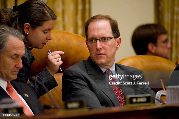 May 11: Chairman Dave Camp, R-Mich., talks to an aides during the House Ways and Means markup of the "Jobs, Opportunity, Benefits and Services Act of...