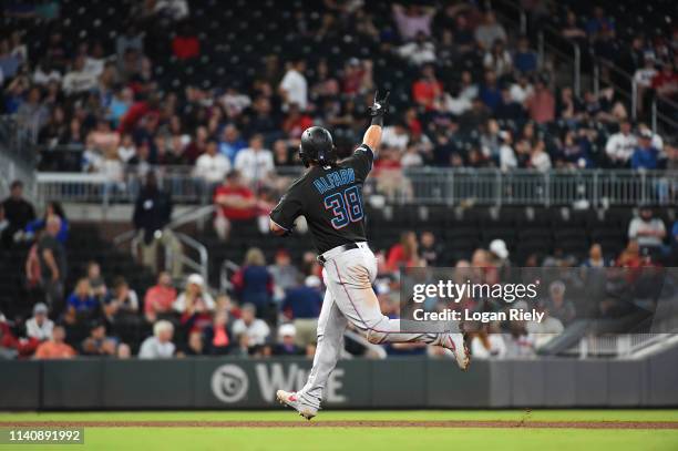 Jorge Alfaro of the Miami Marlins celebrates while rounding the bases after hitting a home run against the Atlanta Braves at SunTrust on April 06,...