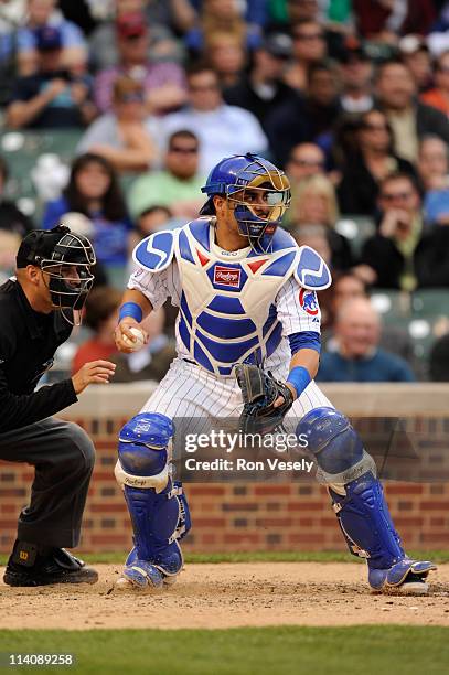 Geovany Soto of the Chicago Cubs catches during the game between the Cincinnati Reds and the Chicago Cubs on May 6, 2011 at Wrigley Field in Chicago,...