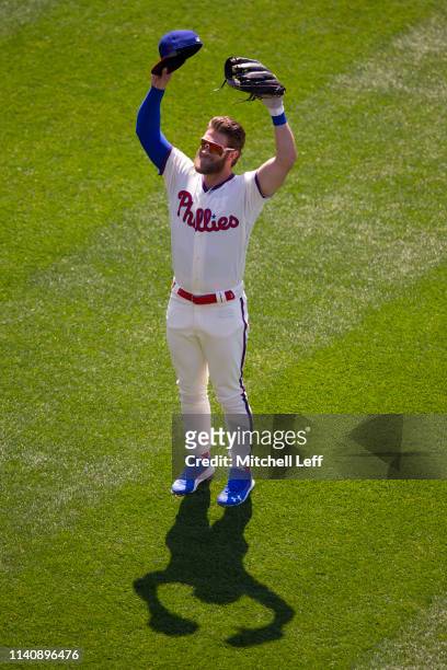 Bryce Harper of the Philadelphia Phillies salutes the crowd prior to the game against the Minnesota Twins at Citizens Bank Park on April 6, 2019 in...