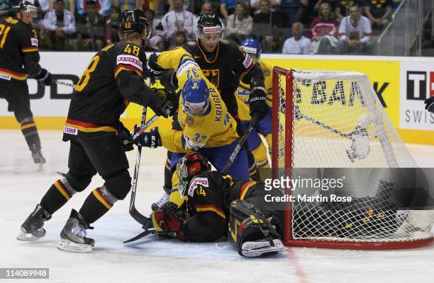 Marcus Krueger of Sweden fails to score over Dennis Endras , goaltender of Germany during the IIHF World Championship quarter final match between...