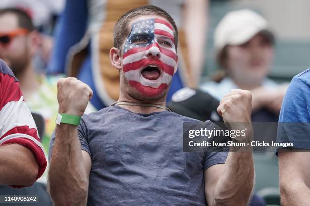Fans celebrate during USA score a try during a cup quarter finsl match between South Africa and USA on day three of the Cathay Pacific/HSBC Hong Kong...