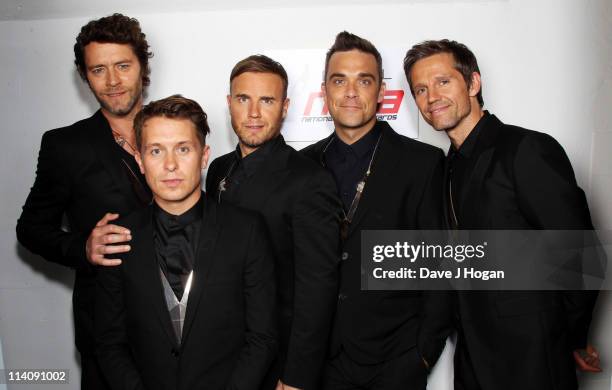 Howard Donald, Mark Owen, Gary Barlow, Robbie Williams and Jason Orange of Take That pose backstage prior to performing at the National Movie Awards...