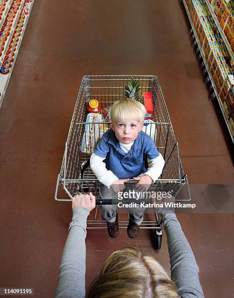 little boy in grocery cart. - burlington iowa fotografías e imágenes de stock