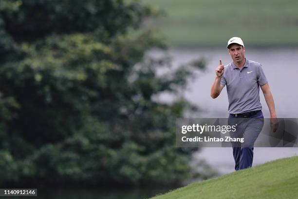 Ross Fisher of England reacts after plays a shot during the day two of the 2019 Volvo China Open at Genzon Golf Club on May 3, 2019 in Shenzhen,...