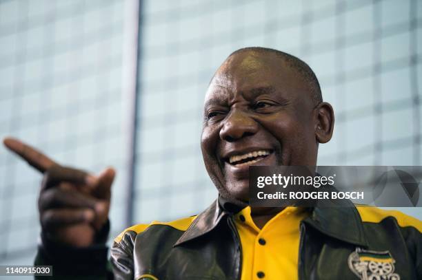 South African President and president of the ruling African National Congress , Cyril Ramaphosa, addresses the crowd during a campaign meeting in...