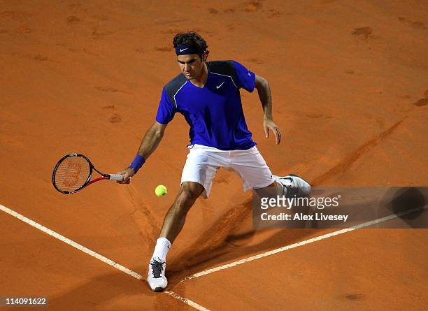 Roger Federer of Switzerland stretches for the ball during his second round match against Jo-Wilfried Tsonga of France during day four of the...