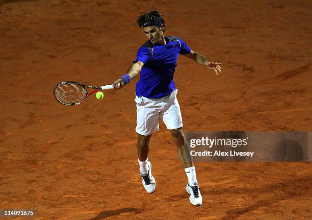 Roger Federer of Switzerland plays a forehand return during his second round match against Jo-Wilfried Tsonga of France during day four of the...