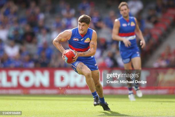 Tom Liberatore of the Bulldogs runs with the ball during the round three AFL match between the Western Bulldogs and the Gold Coast Suns at Marvel...