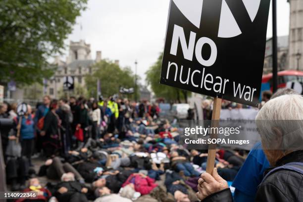 Activists seen lying outside Westminster Abbey during the Thanksgiving service for the Navy. Anti-nuclear protests outside of Westminster Abbey...