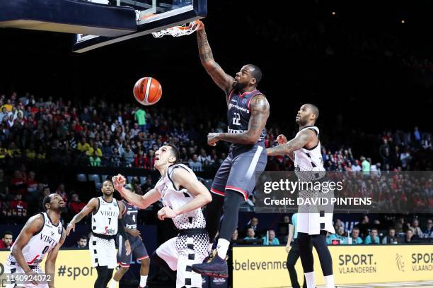 Bamberg's Cliff Alexander scores a dunk during a basketball match between German team Brose Bamberg and Italian Virtus Pallacanestro Bologna, the...