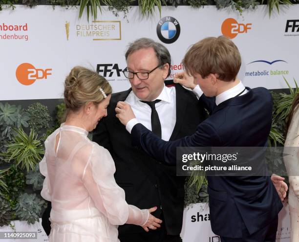 The actor Rainer Bock , his wife Christina Scholz and his son Moritz Bock attend the 69th German Film Award "Lola". Photo: Jörg Carstensen/dpa