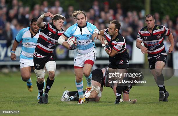 Andy Goode of Worcester is tackled by Gavin Cattle and Philip Burgess during the RFU Championship playoff final 1st Leg match between Cornish Pirates...