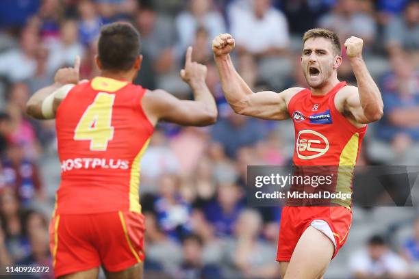 Anthony Miles of the Suns celebrates a goal during the round three AFL match between the Western Bulldogs and the Gold Coast Suns at Marvel Stadium...